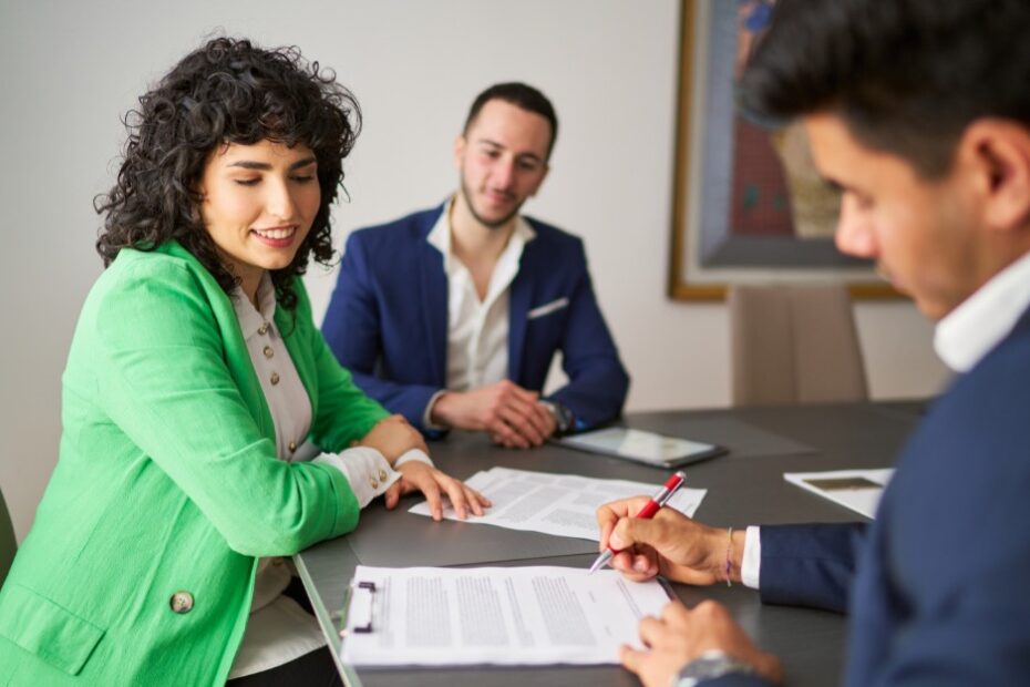 Businessman reading a loan agreement before signing